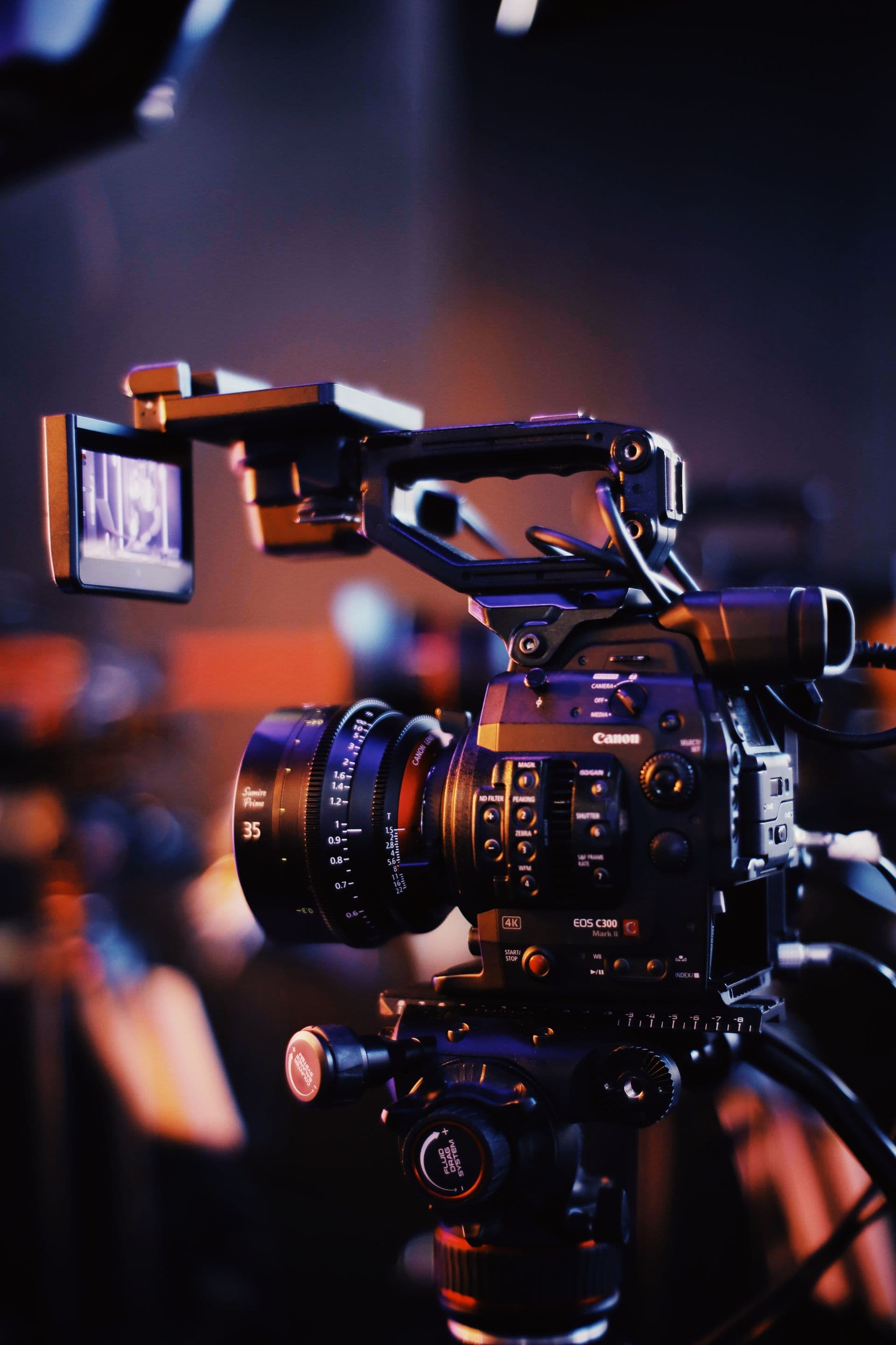 Cinema camera rig with focus gear in bokeh light