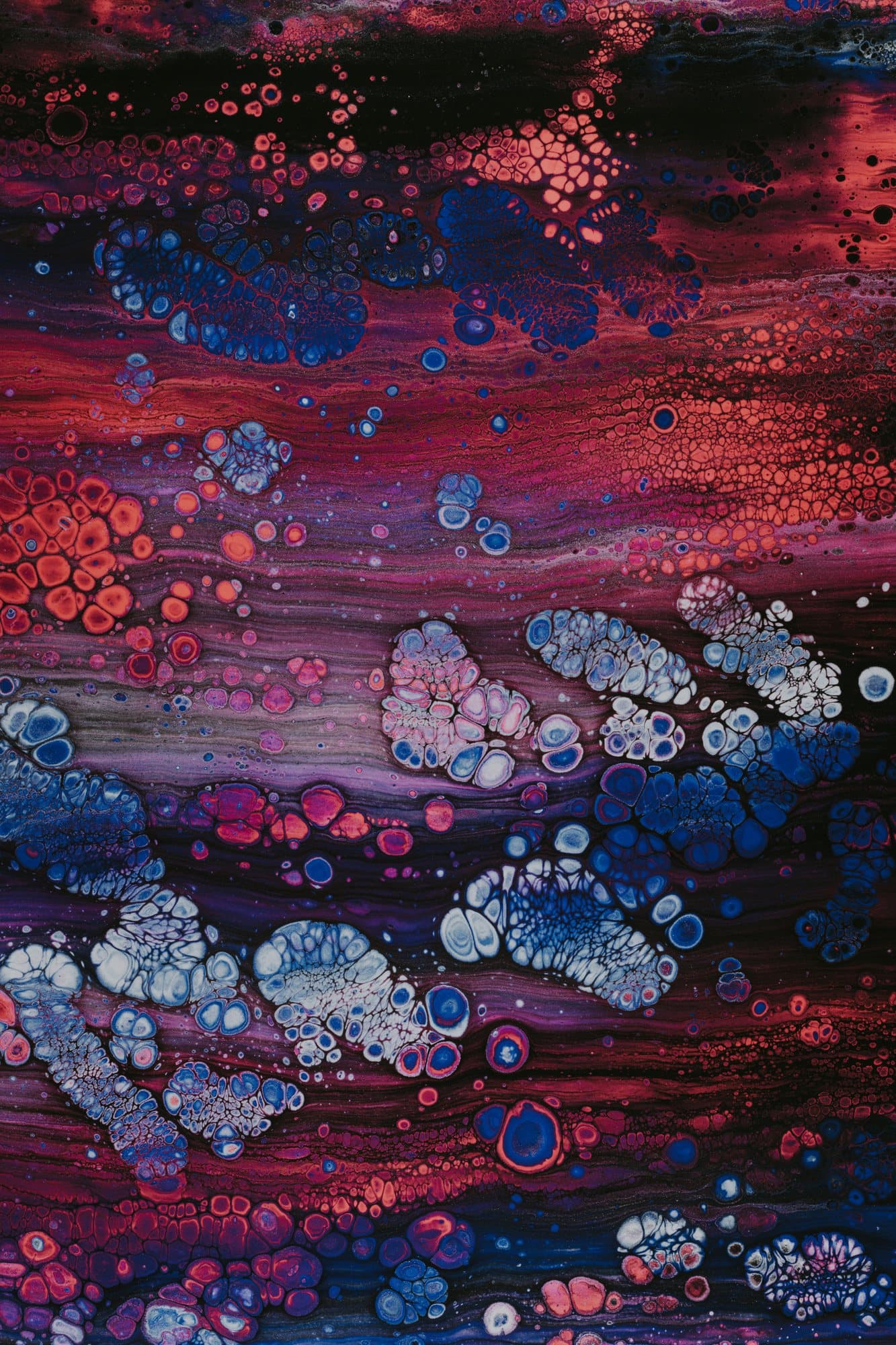 Vivid abstract fluid-art cells in red, blue and purple